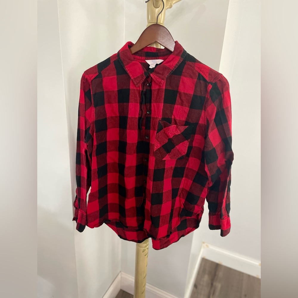Red and black buffalo plaid button down shirt.